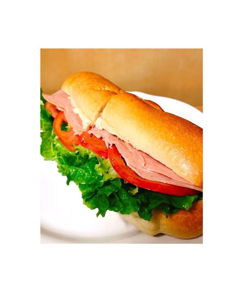 Bologna Sandwich · Includes lettuce, tomato, and choice of dressing.