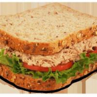 Tuna Salad Sandwich · Includes lettuce, tomato, and choice of dressing.