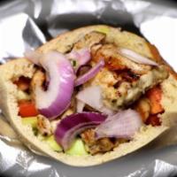 Grilled Chicken Kofta Kebab Sandwich · Comes with a container of mixed salad on the side.