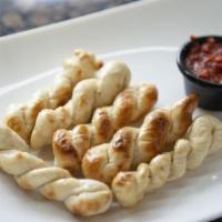 Breadsticks · Breadsticks seasoned with our house garlic herb butter. 8 pieces.