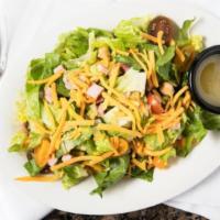 Chop Salad · Romaine lettuce, cheddar, ham, salami, chickpeas, cucumber, celery, tomatoes, and tossed in ...