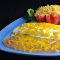 Enchiladas a la Crema · Enchiladas smothered with a rich, decadent cream sauce and cheddar cheese. Tastes best with ...