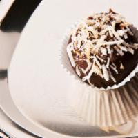 German Chocolate · Chocolate cake mixed with pecans (contains nuts) and coconut dipped in chocolate and garnish...