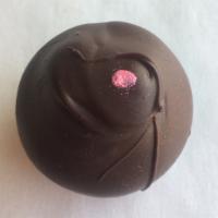 Raspberry Dark Chocolate · Dark Belgian chocolate ganache infused with raspberry and dipped in dark Belgian chocolate