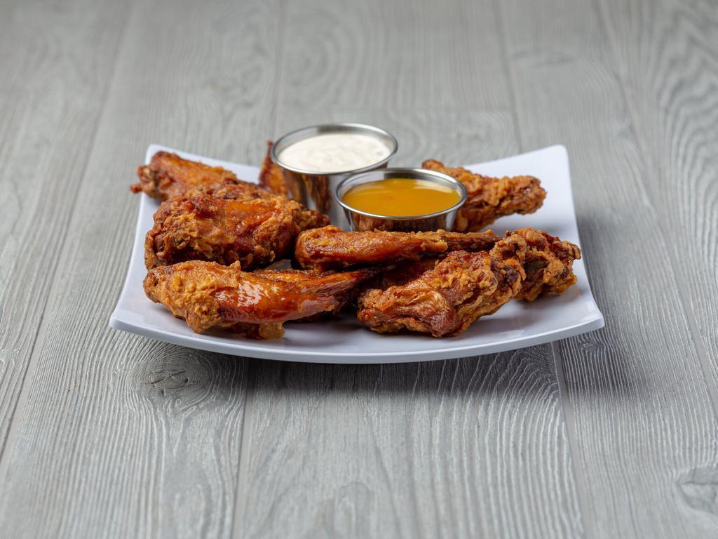 Sal's Birdland Seasoned Jumbo Wings - 10 Piece · 10 piece wing order served with 1 each of Sal's 3.25 oz. cup or Sal's sassy sauce and Sal's Bleu cheese dip.