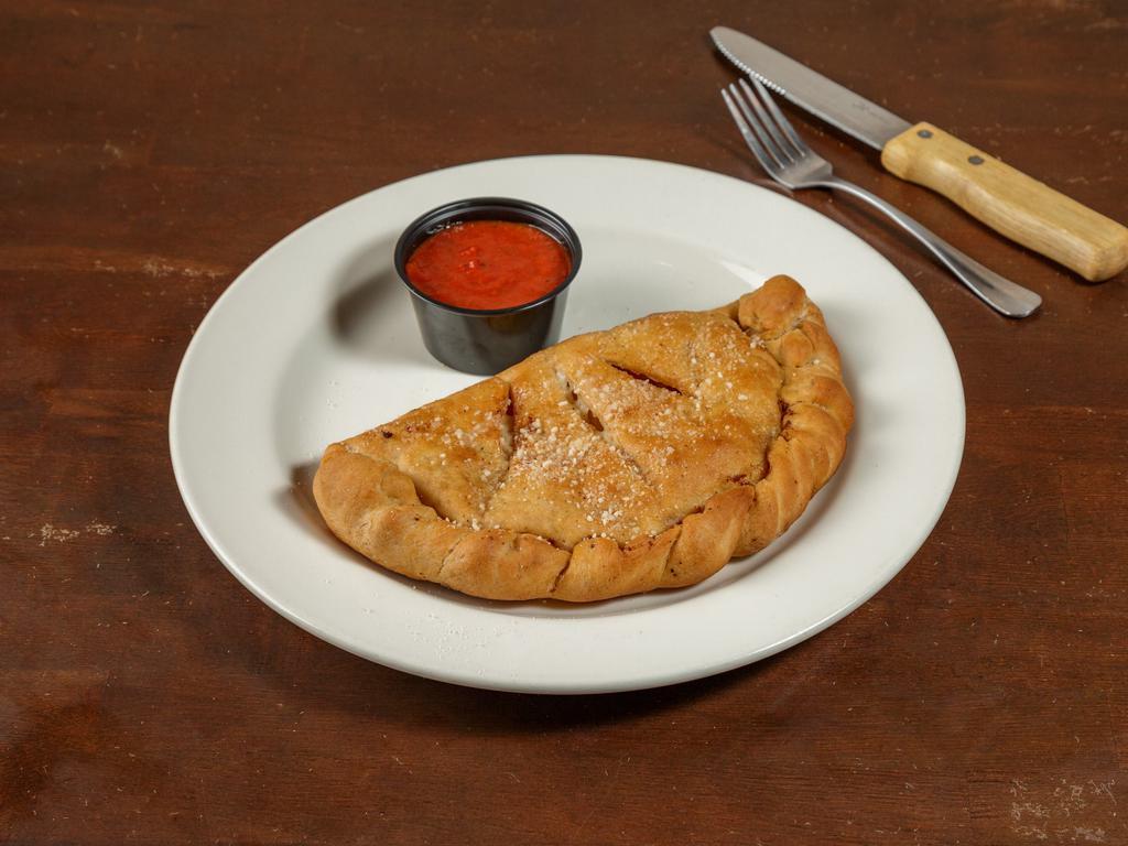 Steak and Cheese Calzone · Thinly sliced premium steak, mozzarella, red onions, and green peppers. Comes with a side of marinara sauce.