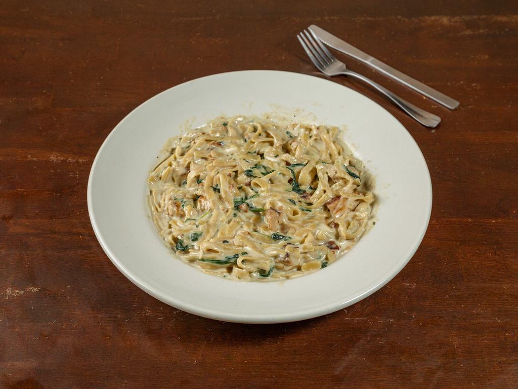 Fettuccini Alfredo Pasta · Fettuccini noodles with our homemade Alfredo sauce with your choice of chicken or shrimp. Add spinach for an additional charge.