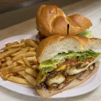 The Big Mama Sandwiche · This mouthwatering sandwich features a sizzling burger patty grilled with melted cheese, wit...