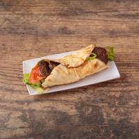 Falafel Sandwich · Crispy falafel with tahini sauce, tomato,lettuce,pepper and onion, serve with French fries.
