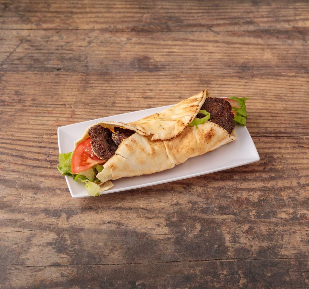 Falafel Sandwich · Crispy falafel with tahini sauce, tomato,lettuce,pepper and onion, serve with French fries.