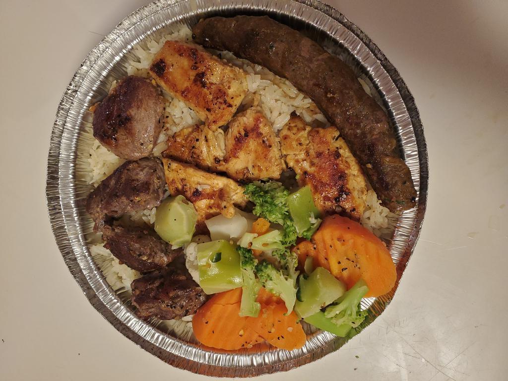 Ali Baba Mix Grill · Mixed Beef and Lamb Kofta, Lamb or Beef Cubes and Chicken serviced with Rice or Fries and Steamed vegetables  
