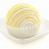 Lemon Cake Bite · Tart and tangy! Our delicious lemon cake is blended with lemon frosting, dipped in vanilla c...