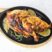 1/2 Pollo a la Brasa Rotisserie Chicken · Peruvian-style rotisserie chicken, that is brined for 24 hours, marinated for 24 hours, drie...