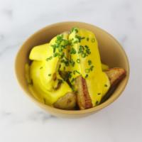 Rotisserie Potatoes with Spicy Cheese Sauce · Papas a la Huancaina: Slow Cooked Yukon Gold Potatoes, tossed in Red Chile and Rotisserie Dr...
