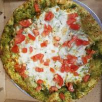 Chicken Pesto Pizza · Basil pesto sauce, fresh chopped tomatoes, artichoke hearts, chicken breast and chopped garl...