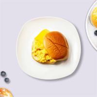 The Classic Egg and Cheese Sandwich · The timeless egg and cheese. Scrambled egg, cheddar cheese, sliced tomato and caramelized on...