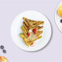 The French Toast · Fresh bread battered in egg, milk, and cinnamon cooked until spongy and golden brown. Served...