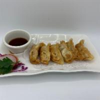 Gyoza · 6 pieces. Pork or vegetable. Green onions and pork filled dumpling fried to golden perfectio...