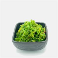 Seaweed Salad · Shiny translucent seaweed-tinted noodles, topped lightly with a tangy vinaigrette and sesame...