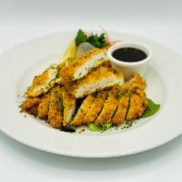 Chicken Katsu · Lightly fried sliced chicken breast, served with a side of tonkatsu sauce and vegetable.