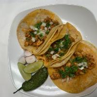 Chicken tacos · Chicken tacos With Corn or flour tortilla Come with cilantro onions lemons green or red sauce