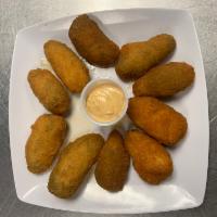 Jalapeno Poppers · 8 pieces spicy with a crispy cheesy finish.