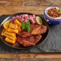 Milanesa de Pollo · Breaded chicken with fried cassava, rice, beans and salad.