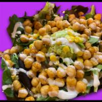 Curry Style Over Greens · Mixed greens topped with smashed avocado, red onion, sweet corn over greens, topped with our...