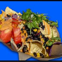 Chipotle Nachos - Large · Crispy Organic Nachos with Black Beans, Red Cabbage, Pico de Gallo, Avocado topped with our ...