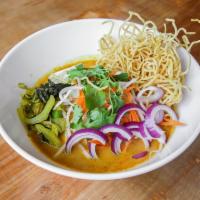 Khao Soi · Curry noodles. Northern-style curry noodles with lettuce, pickle, shallots, bean sprouts, ci...
