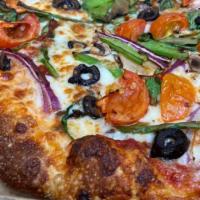 Veggie Pizza · House-made dough covered with ridotta garlic blend, topped with all freshly prepared veggies...