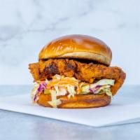 Fried Chicken Sandwich · Buttermilk brined chicken, tossed in our house spice mix, and served on a toasty brioche bun...