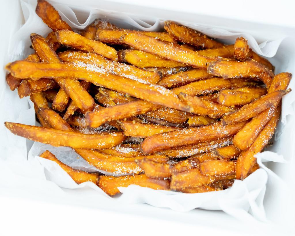Sweet Potato Churro Fries · Sweet potato fries tossed with cinnamon and sugar.