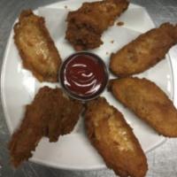 Piece Chicken Wings ( 6 PCs).  · Cooked wing of a chicken coated in sauce or seasoning.