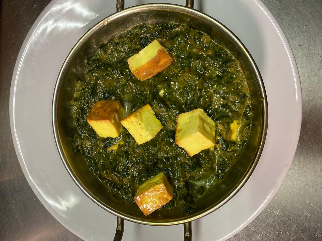  Saag Panner  · Fresh Indian cheese and spinach cooked with mild cream and onion sauce.  