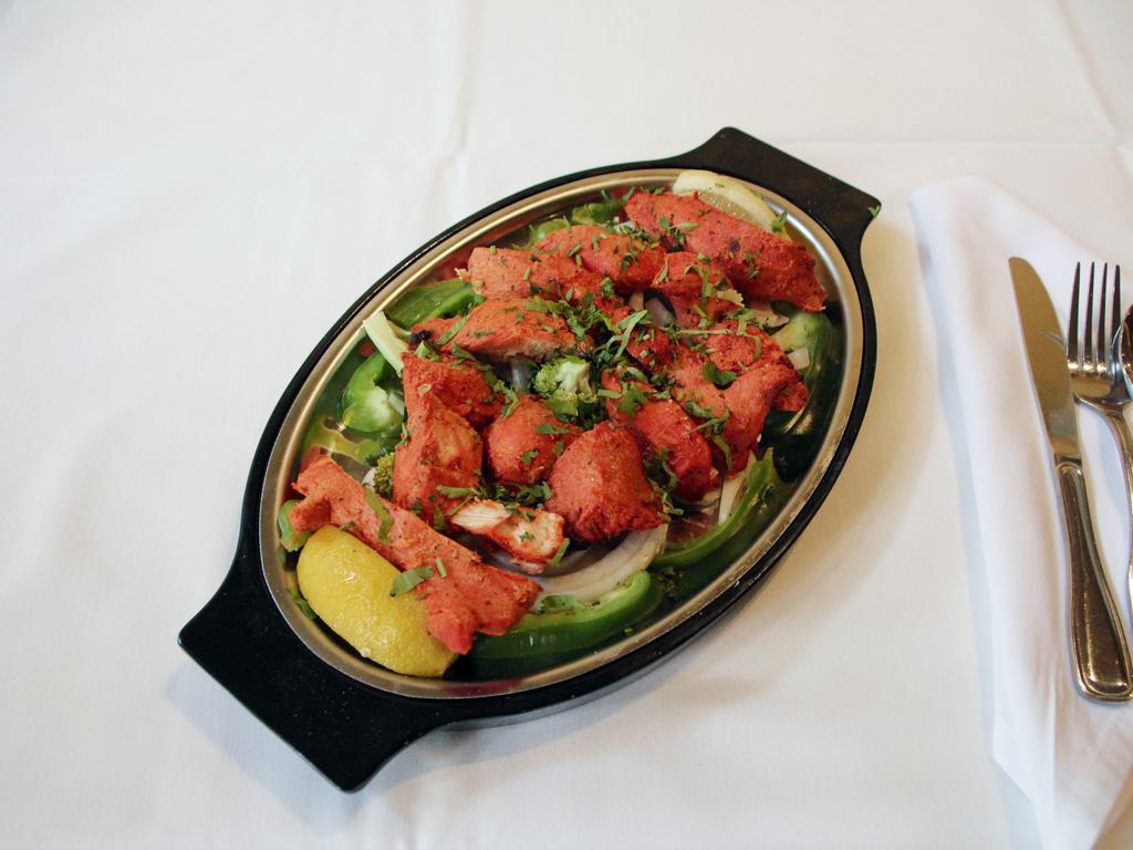Chicken Tikka Specialty · Tender chicken marinated in yogurt blended with mild spices and fresh herbs then baked on skewers.