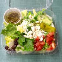 Greek Salad · Tomato, feta cheese, Kalamata olives, pepperoncini peppers and cucumbers with bogies dressing.