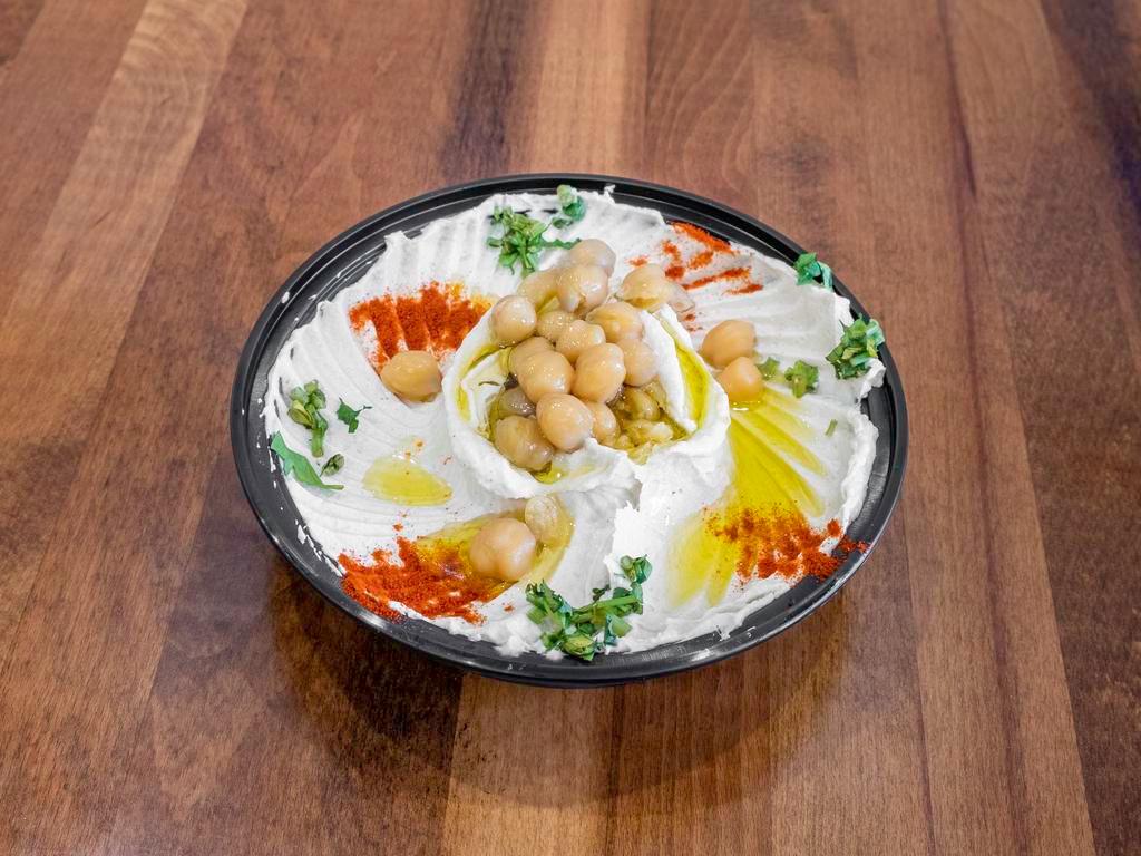 Small Hummus · Our chef's special recipe made of chickpeas and tahini. Comes with 1 piece of pita.