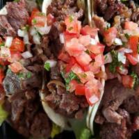 Beef Tacos (Halal) · Three flour tortilla tacos with beef bulgogi (Halal), lettuce, shredded moneterey jack chees...