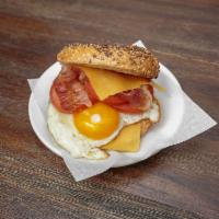 The Breakfast Bagel Sandwich · Golden-fried eggs with a delicately seasoned pork sausage patty, and melted Tillamook chedda...