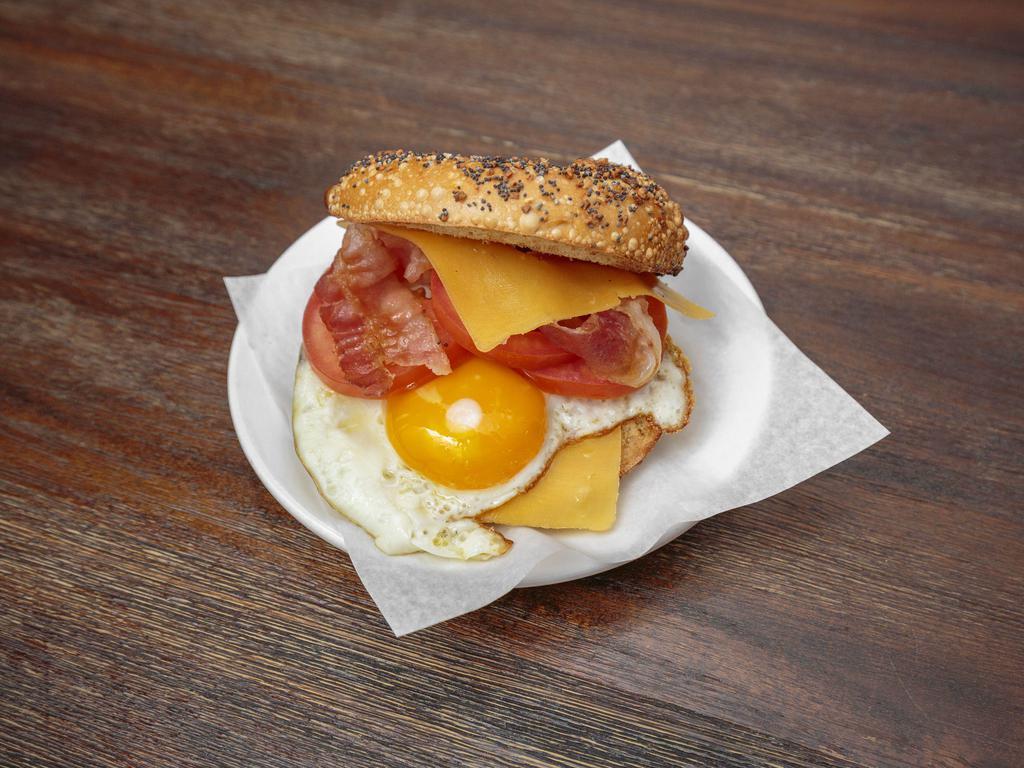 The Breakfast Bagel Sandwich · Golden-fried eggs with a delicately seasoned pork sausage patty, and melted Tillamook cheddar cheese.