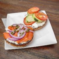 The Veggie Lox Bagel Sandwich · Thinly sliced smoked salmon, crisp cucumber, vine-ripened tomatoes, red onion, and cream che...