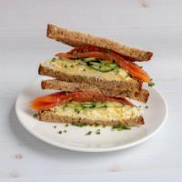  Salmon and Egg Sandwich  · House cured salmon, egg salad, cucumber, dill butter on multigrain.