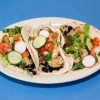 3 Shredded Chicken Taco ·  on,Soft corn filled refried beans with  lettuce, pico de gallo.