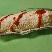Mexican Corn on the Cob / elotes estilo mexicanos · On the top mayonnise an cheese and de spicy sauce
 .
