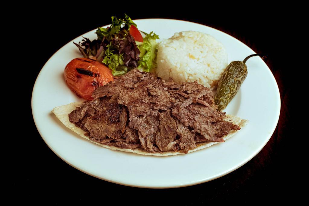 Lamb Gyro · Marinated meat gyro vertically grilled. Served with rice and salad.