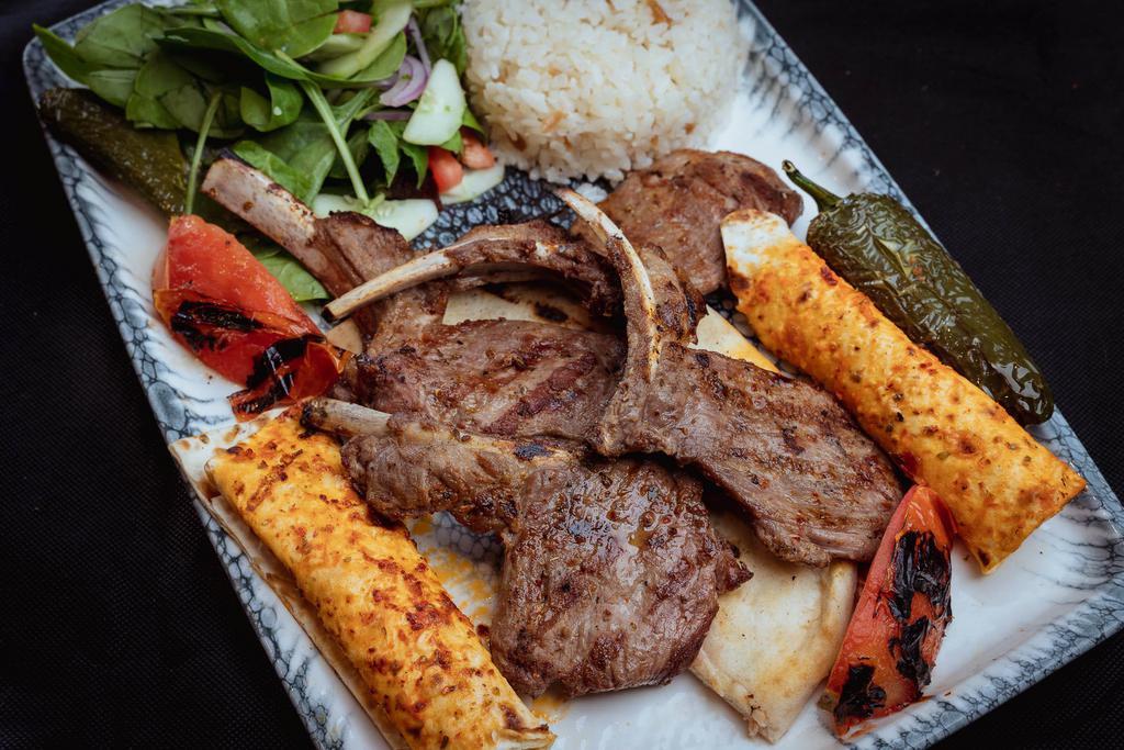 Lamb Chops · Grilled tender Lamb chops. Served with rice and house salad 