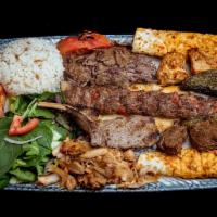 Mixed Grill · Gyro, shish kebab, chicken shish kebab, lamb chops and adana kebab. Served with rice and col...