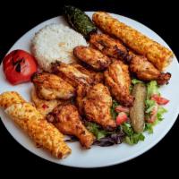 Grilled Chicken Wings · 10 pieces. Marinated grilled chicken wings. Served with rice and coleslaw.
