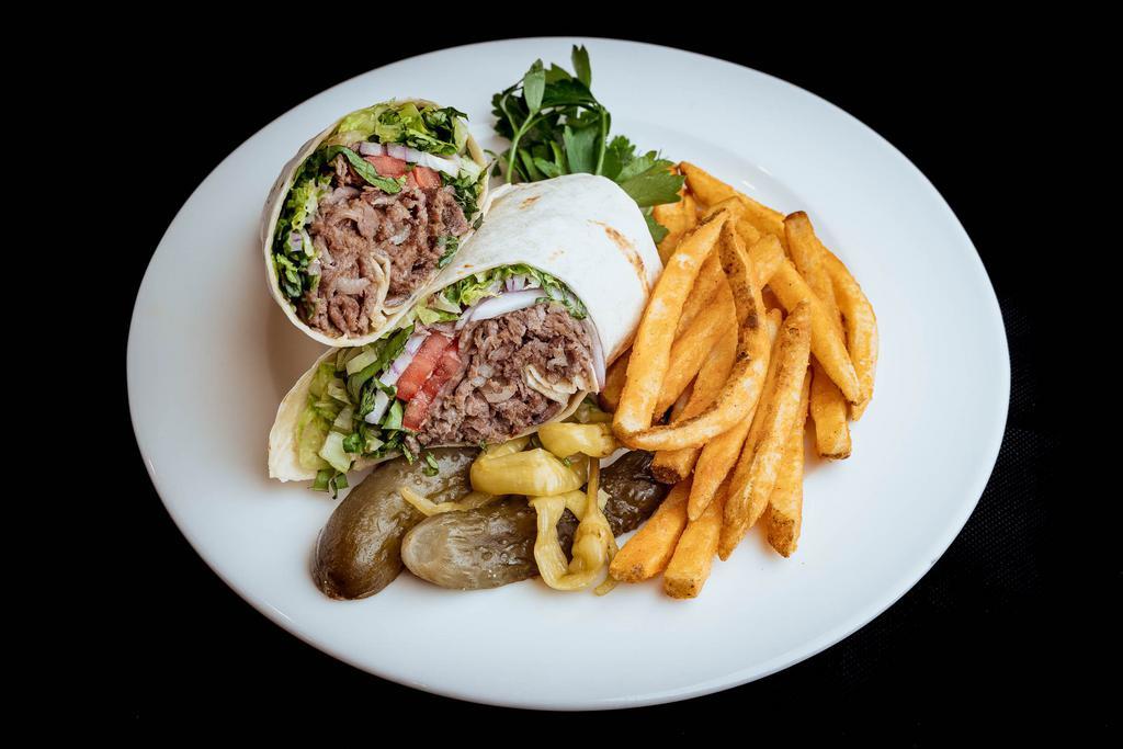 Lamb Gyro Wrap · Marinated lamb meat vertically grilled. Served with salad wrapped in lavash.
